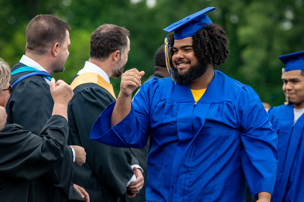 SHS student walks across the stage to receive his diploma during the 2022 Commencement Ceremony